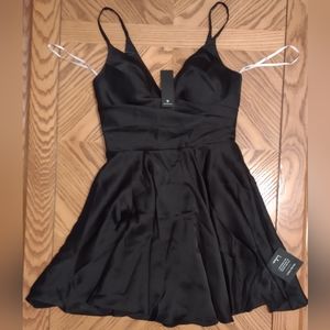 Lulu's remarkable romance black satin skater dress with pockets